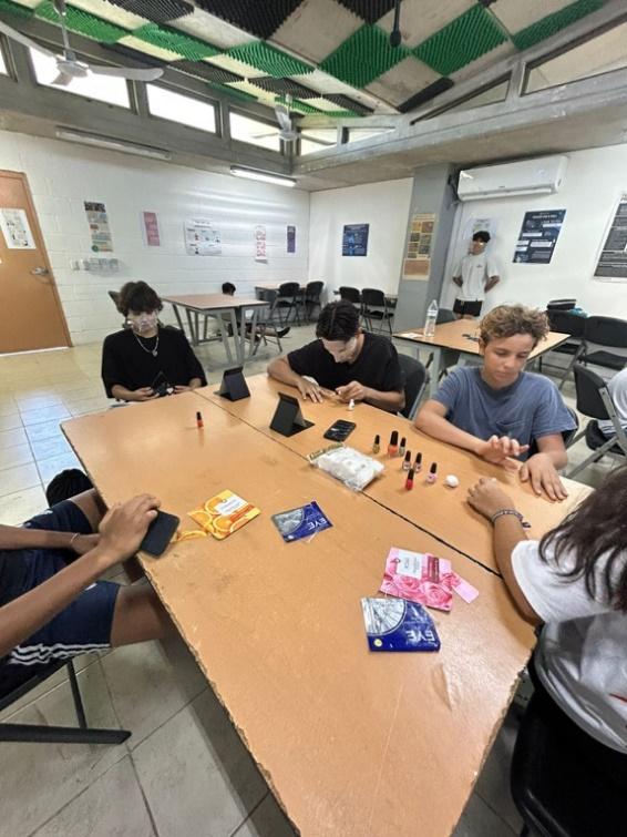 A group of people sitting at a table
Description automatically generated